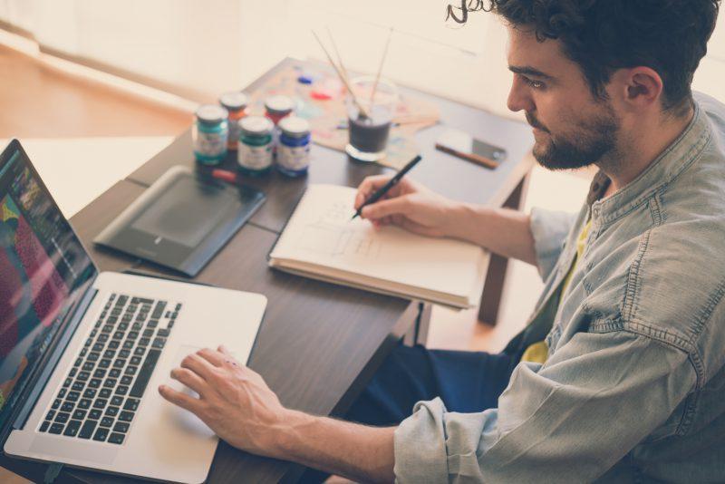 Handsome Hipster Modern Man Working Home Using Laptop